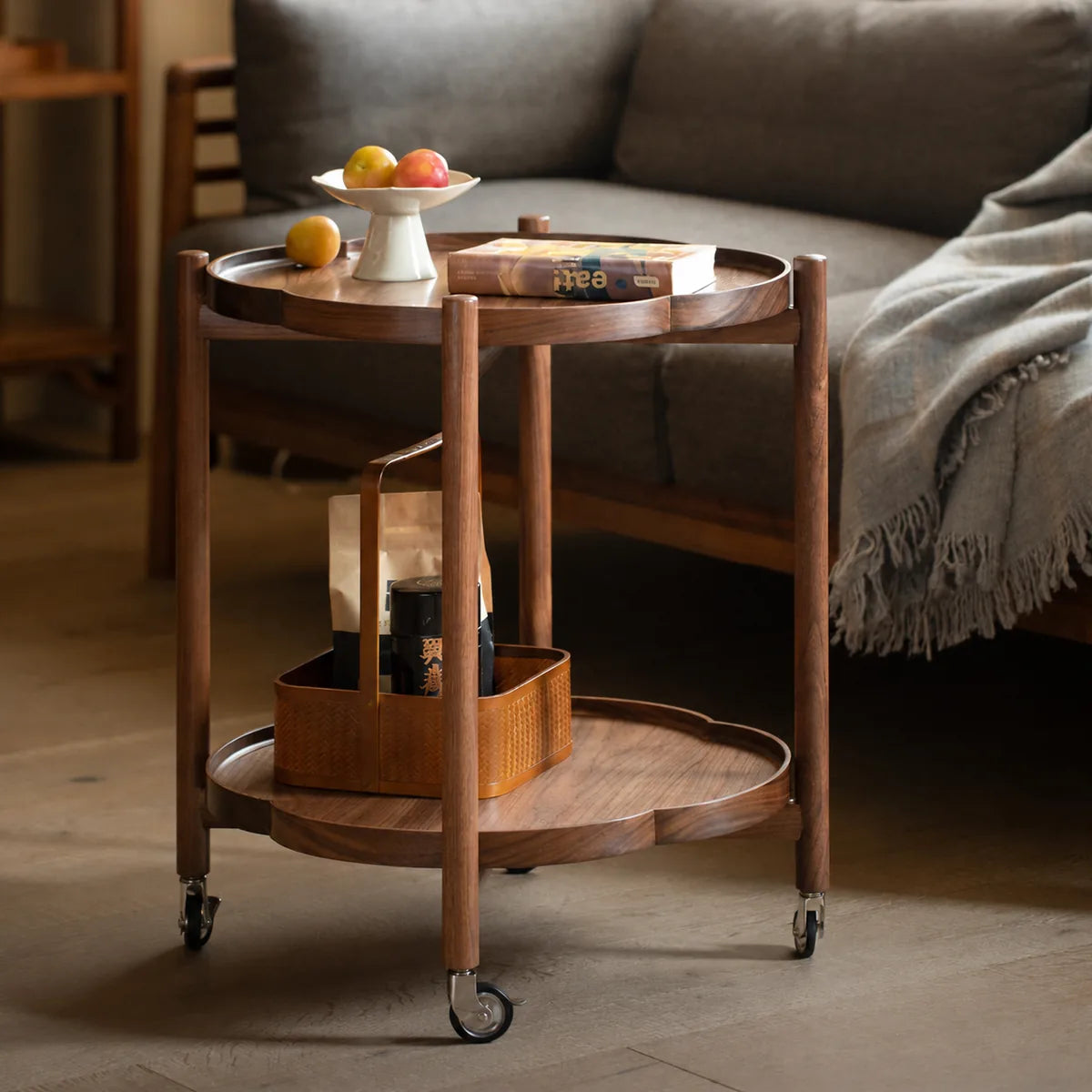 Walnut two-tier side table styled in a living room