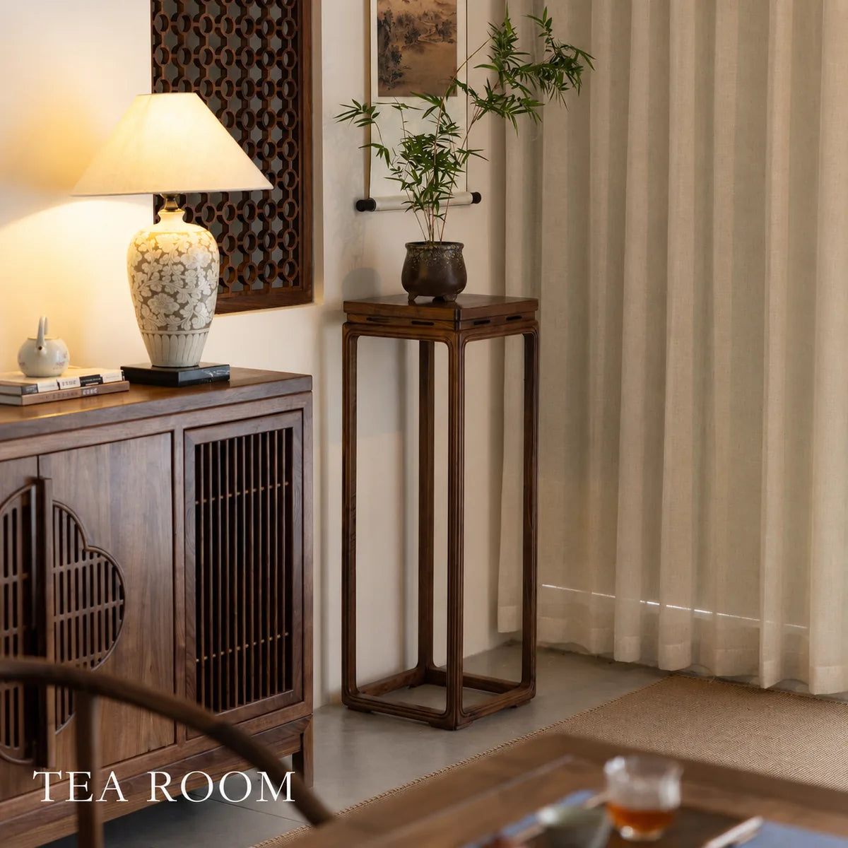 Tall flower stand in a tea room interior