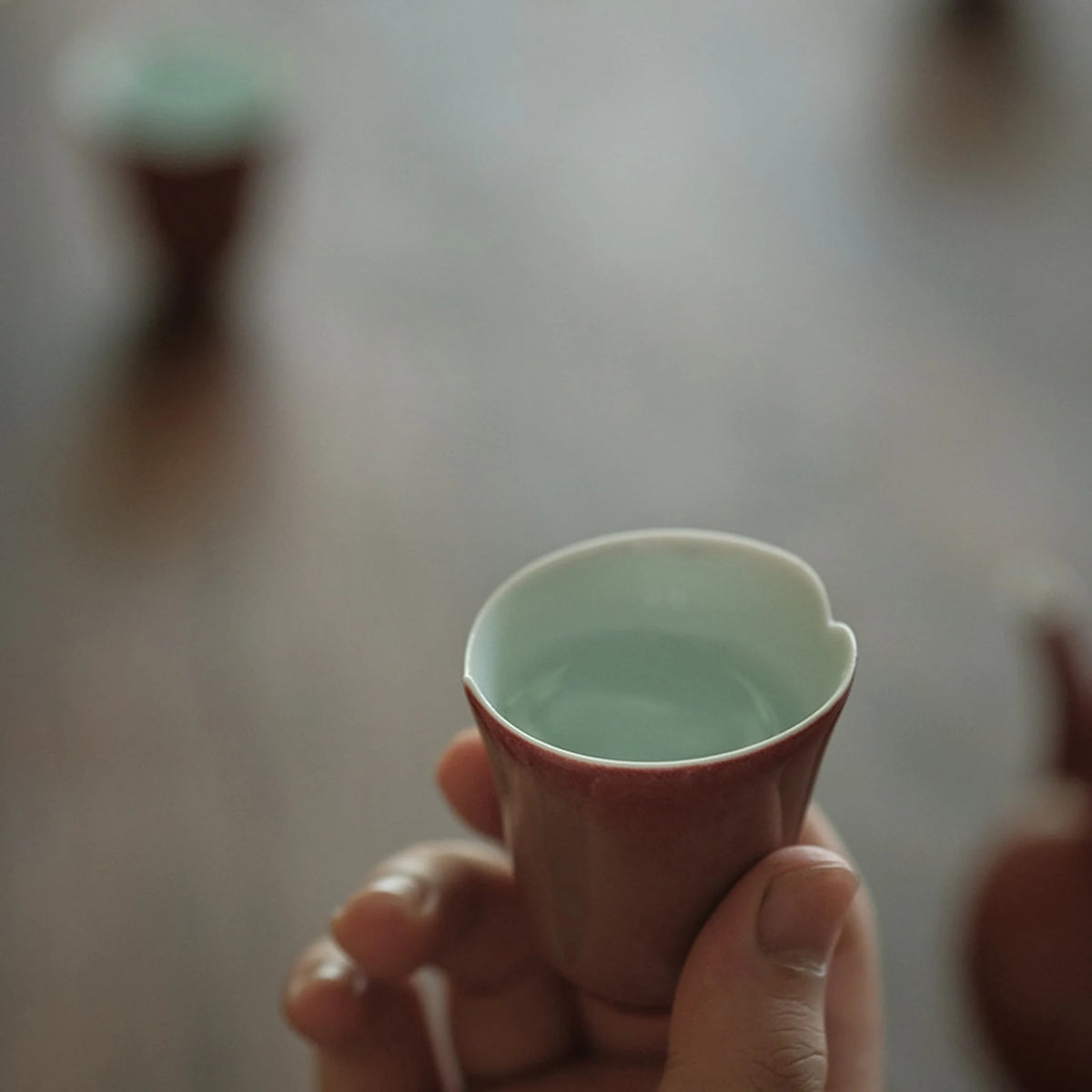 Close view of the pale interior of a rose glaze tea cup