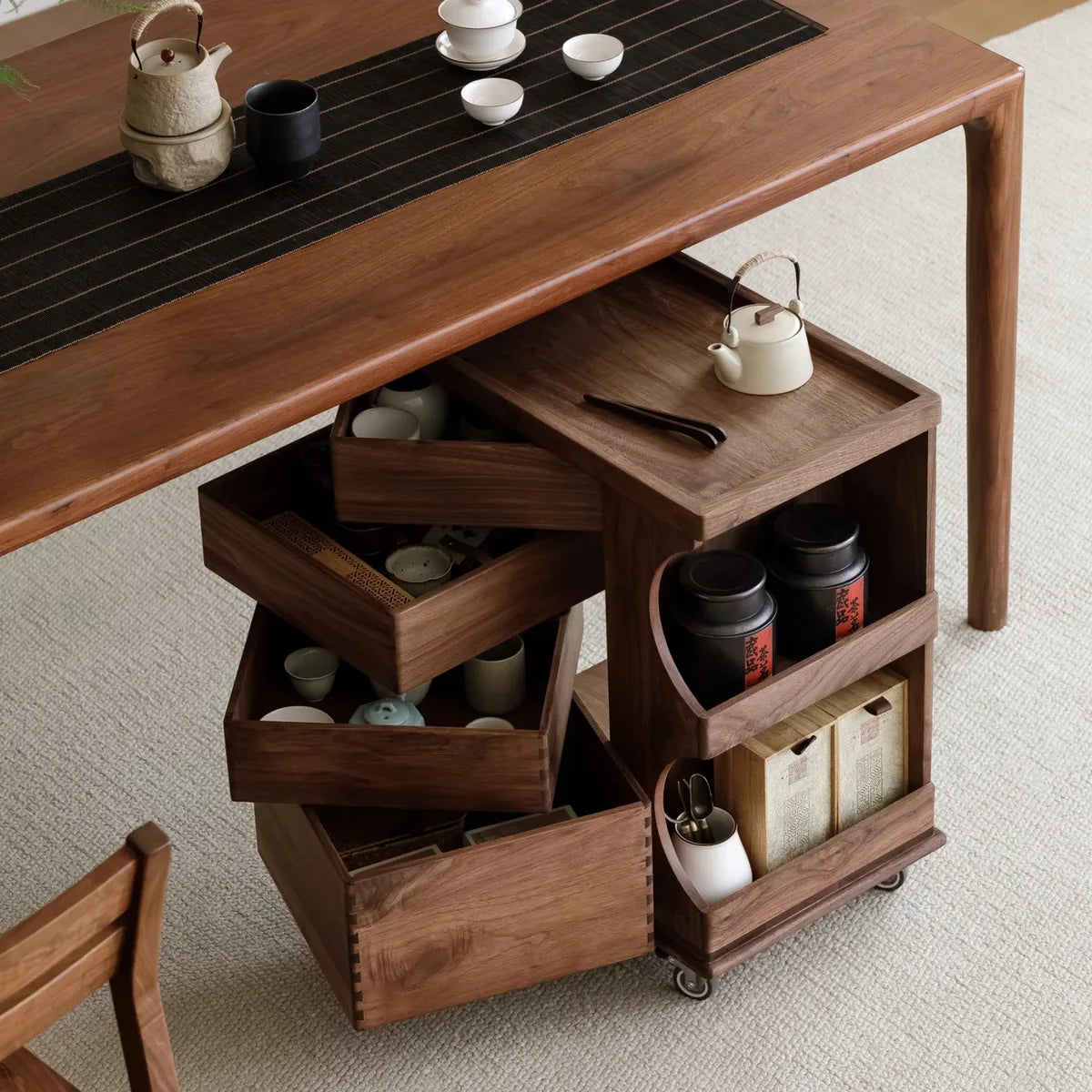 Four drawers opened to show teaware storage