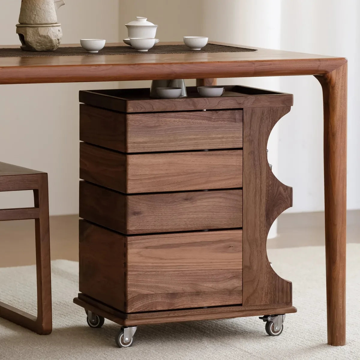 Walnut cabinet with four closed drawers