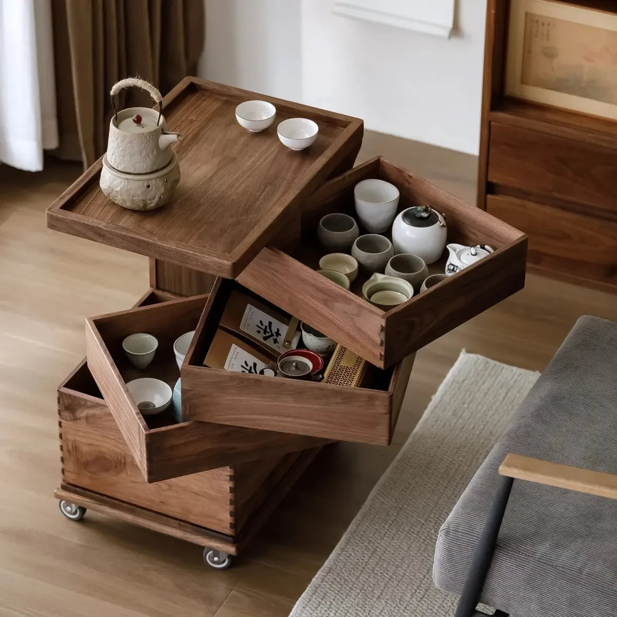 Teaware organized inside the cabinet drawers