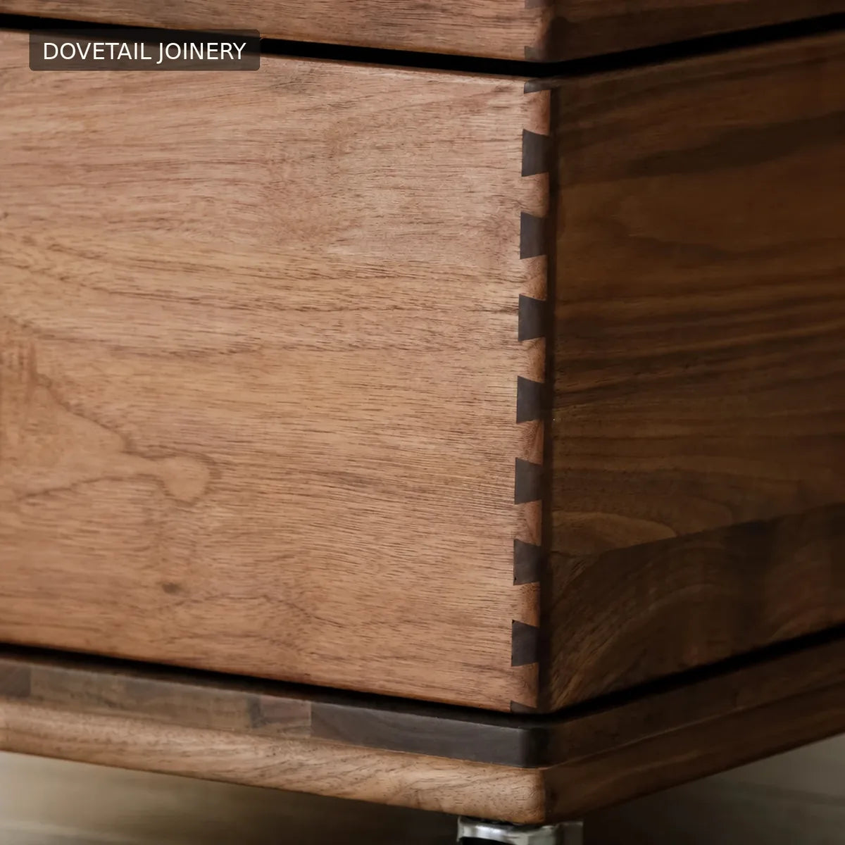 Close-up of dovetail joinery on a walnut drawer