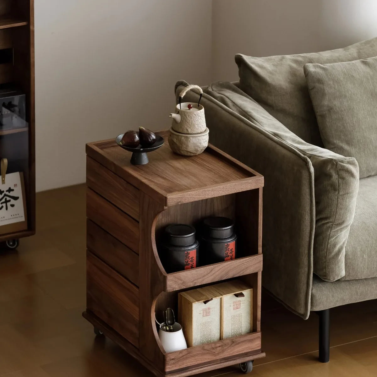 Mobile tea cabinet beside a living room sofa