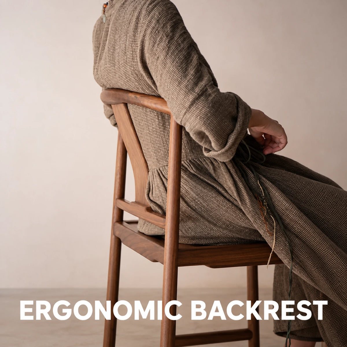 Person seated in the Half-Moon Dining Chair