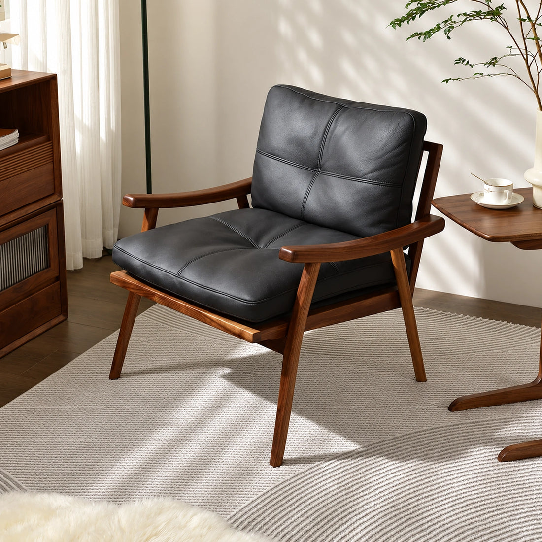 Solid wood lounge chair with black leather cushion, front view